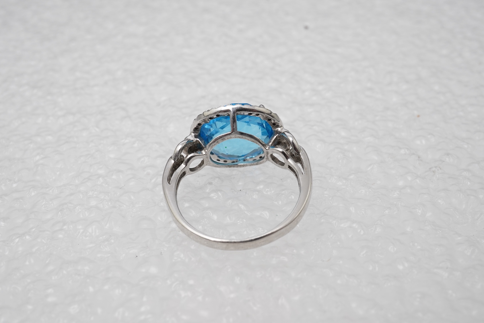 A blue topaz and diamond ring